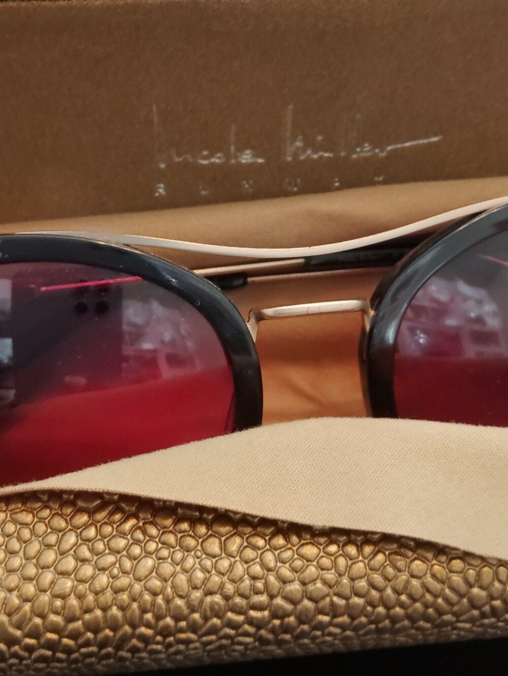 Nicole Miller Black Frame Sunglasses with Red Lenses